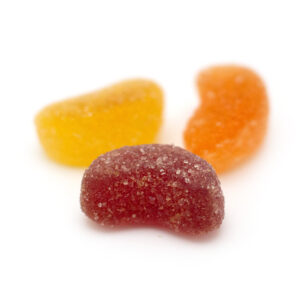 Vegan Delta-9 THC edibles in the form of fruit slice gummies on display from Dama Botanicals.