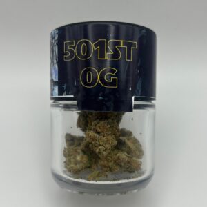 An eighth of the THCA flower 501st OG in a glass jar.