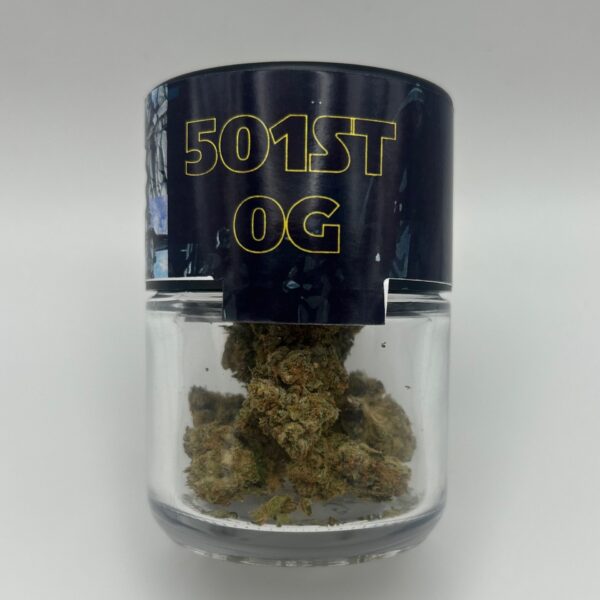 An eighth of the THCA flower 501st OG in a glass jar.