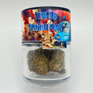 An eighth of the THCA flower Truffles Trainwreck in a glass jar.