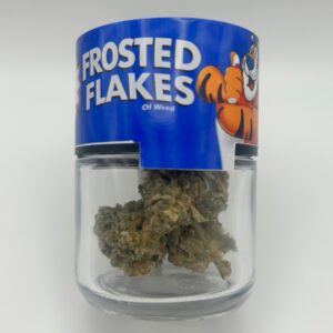 An eighth of the THCA flower strain Frosted Flakes in a glass jar.