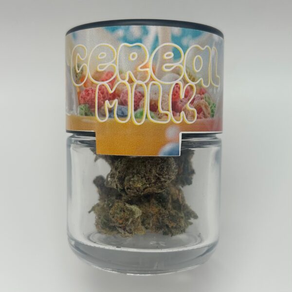 An eighth of Cereal Milk, a THCA flower strain in a glass jar from Dama Botanicals.