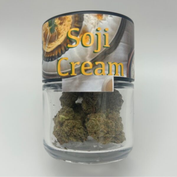 An eighth of the THCA flower Soji Cream Cake in a glass jar.